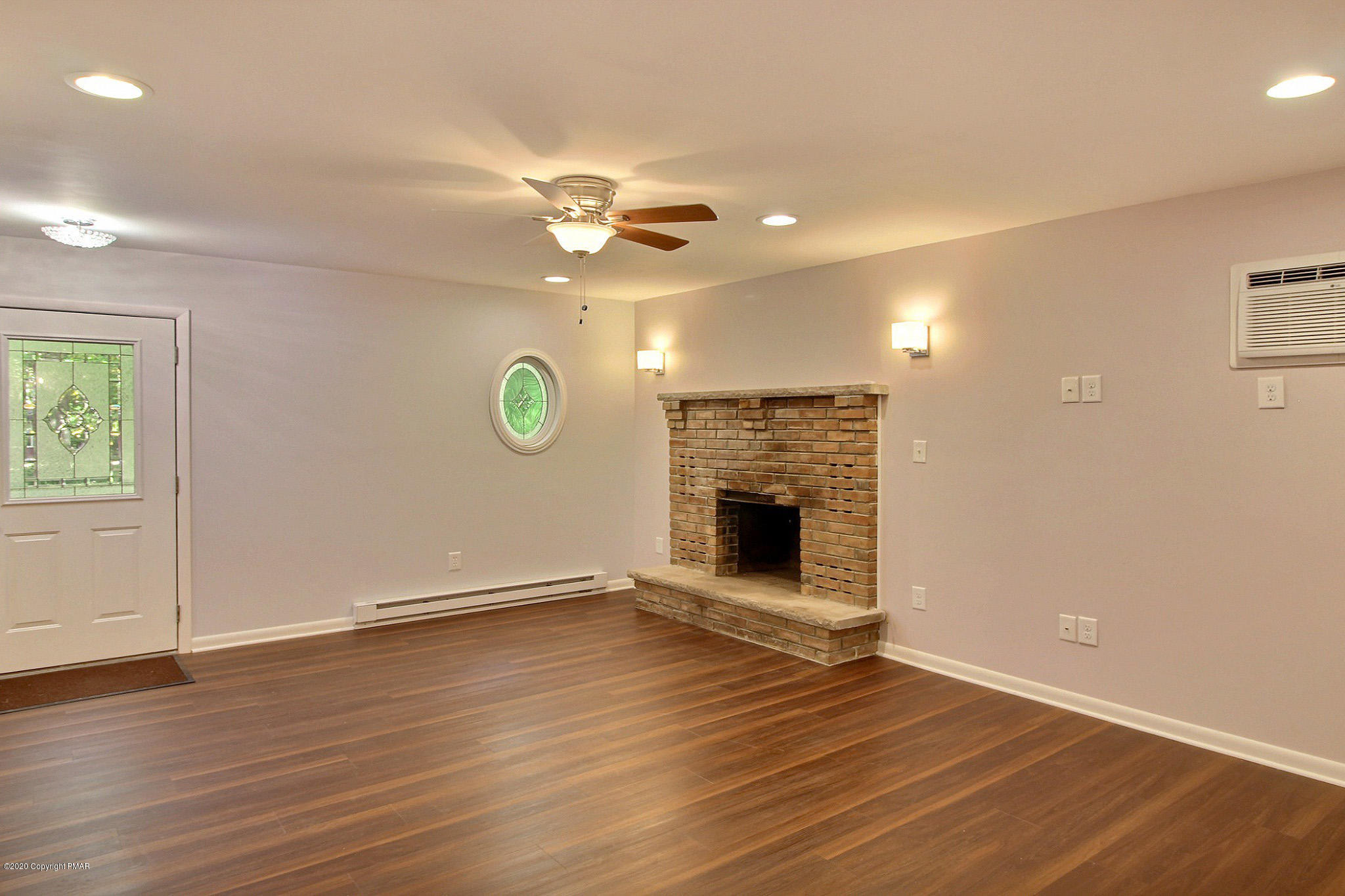 1191 Mattioli Road Bartonsville, PA 18321 - Photo 6 of 17 an empty room with wooden floor and windows