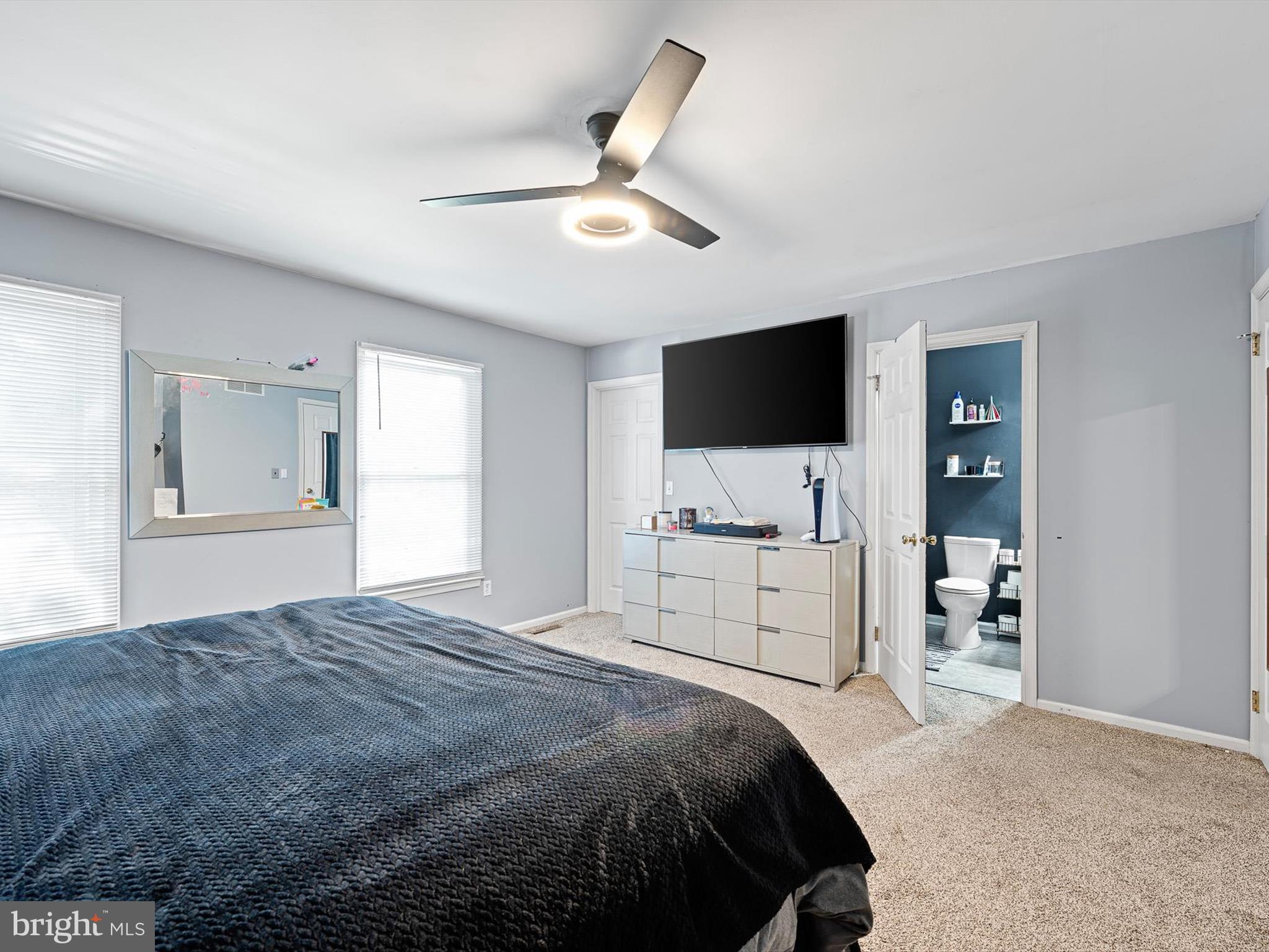 103 Osprey Court Camden Wyoming, DE 19934 - Photo 17 of 34 a bedroom with a large bed and a flat screen tv