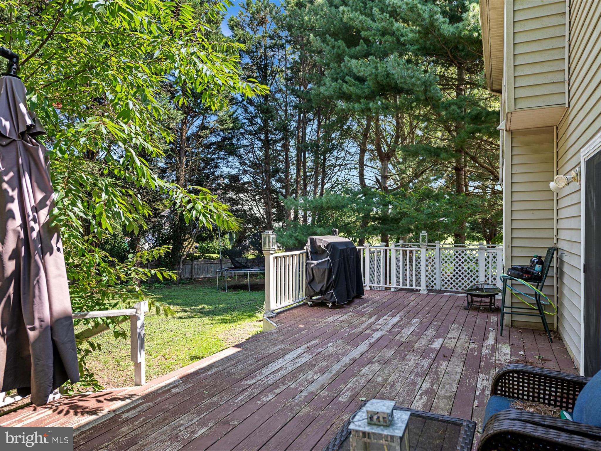 103 Osprey Court Camden Wyoming, DE 19934 - Photo 29 of 34 a view of a deck with furniture and garden
