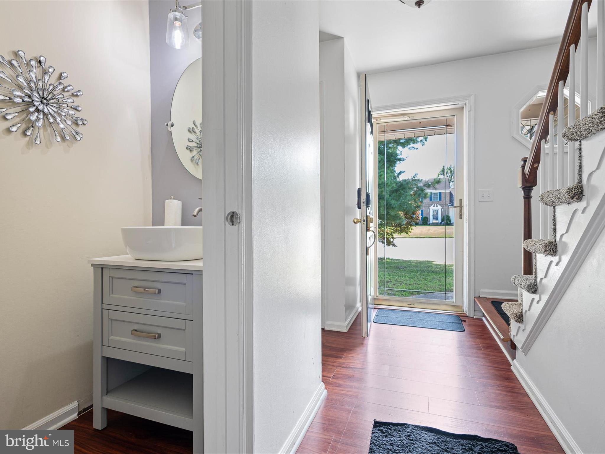 103 Osprey Court Camden Wyoming, DE 19934 - Photo 6 of 34 a view of a hallway to a livingroom and a livingroom with furniture
