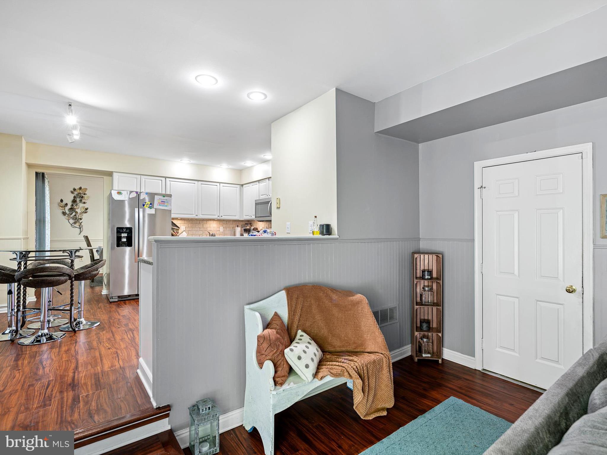 103 Osprey Court Camden Wyoming, DE 19934 - Photo 7 of 34 a living room with furniture and wooden floor