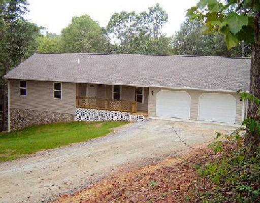 245 Deep Woods Road Hardy, VA 24101 - Photo 1 of 1 a front view of a house with a garden and yard