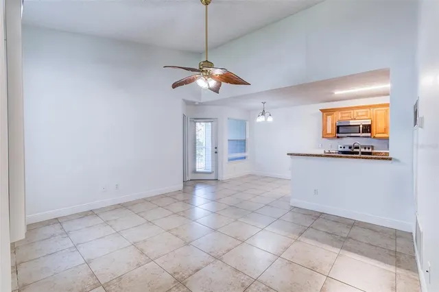 a view of a kitchen with a sink and cabinets