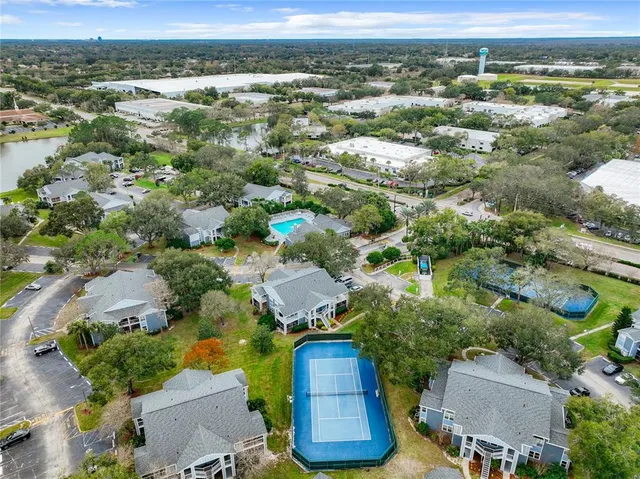 an aerial view of residential houses with outdoor space