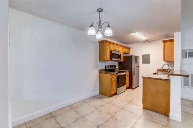 a view of a kitchen stove and microwave