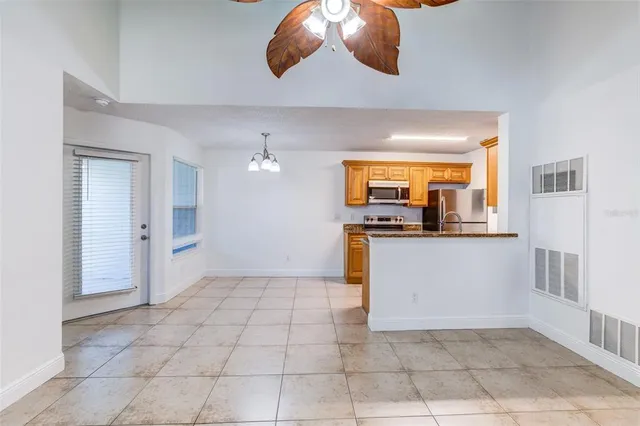 a kitchen with a sink a counter space cabinets and appliances