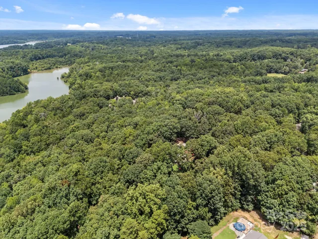 an aerial view of a houses with a yard