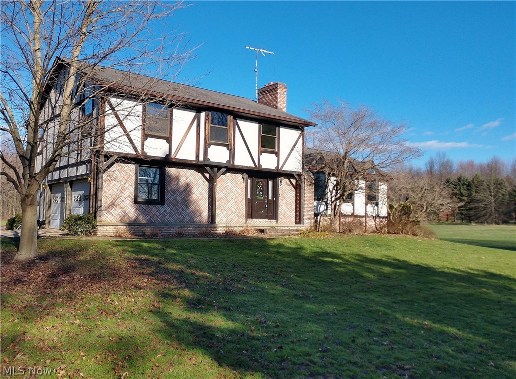 915 Sandy Lake Road Kent, OH 44240 - Photo 2 of 35 Situated far back from the road with a view of the pond, this home is an oasis!