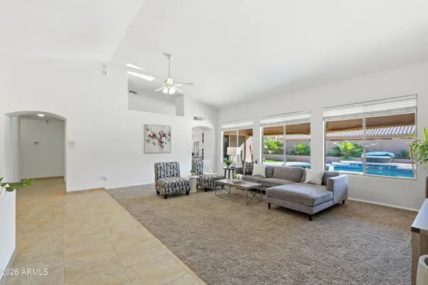 a living room with furniture and a large window