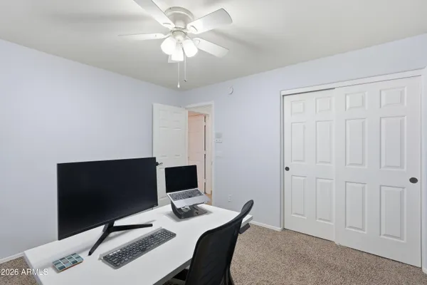 a view of a workspace with furniture