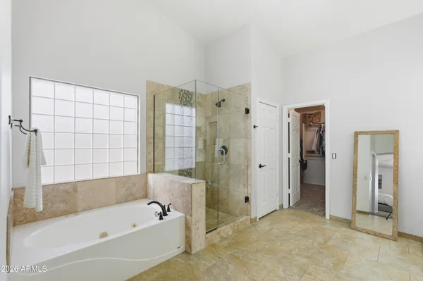 a bathroom with a bathtub and a shower