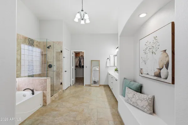 a spacious bathroom with a double vanity sink and a shower