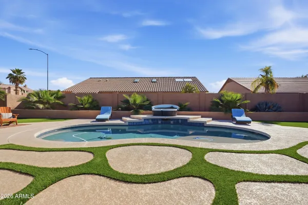 a view of swimming pool with outdoor seating