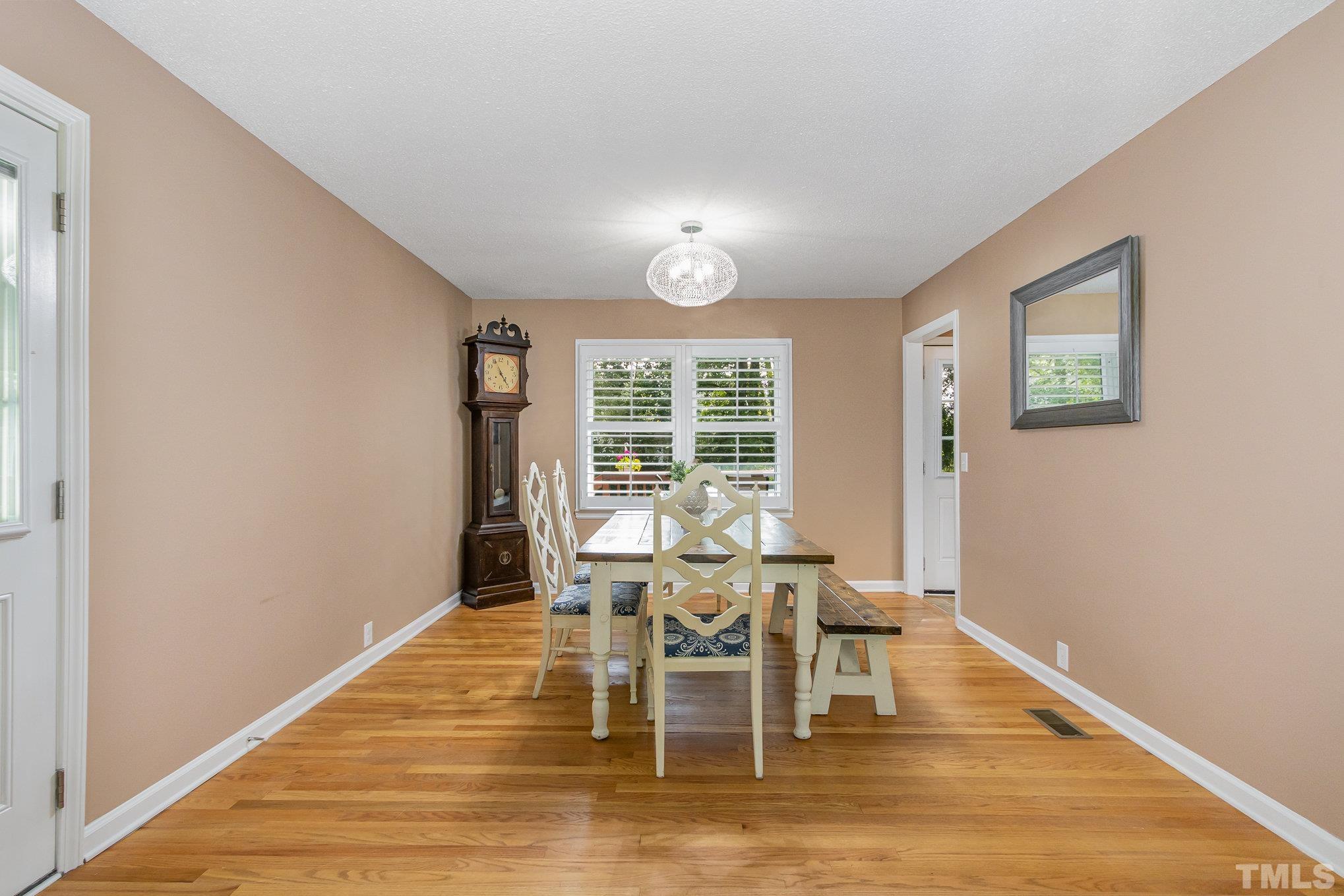 1712 Riverview Road Raleigh, NC 27610 - Photo 11 of 27 a dining room with wooden floor and window