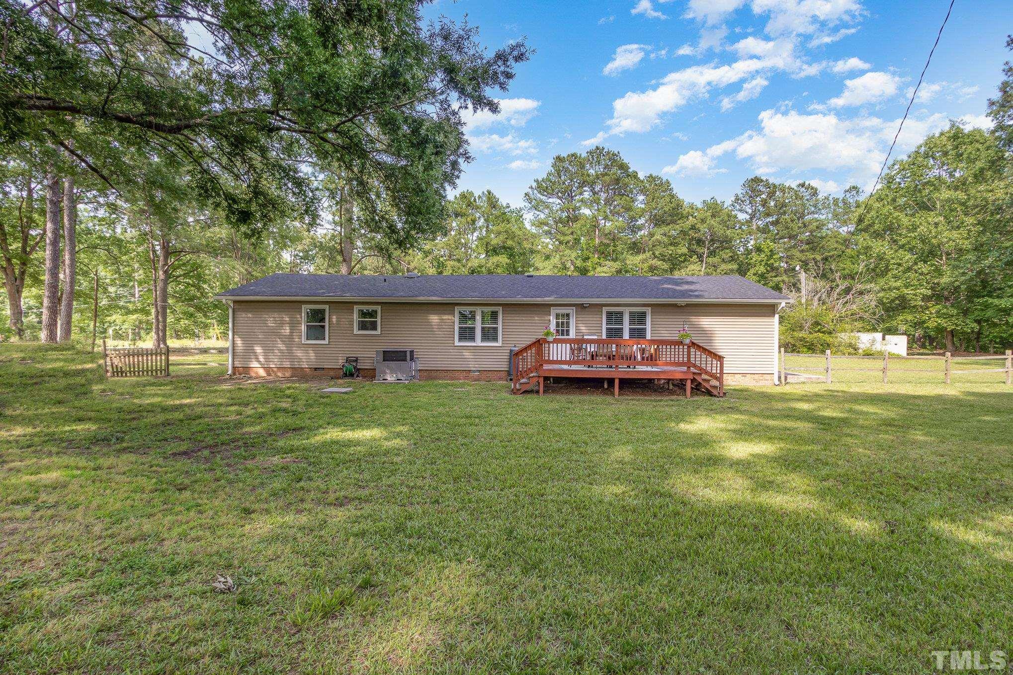 1712 Riverview Road Raleigh, NC 27610 - Photo 20 of 27 a front view of a house with a garden