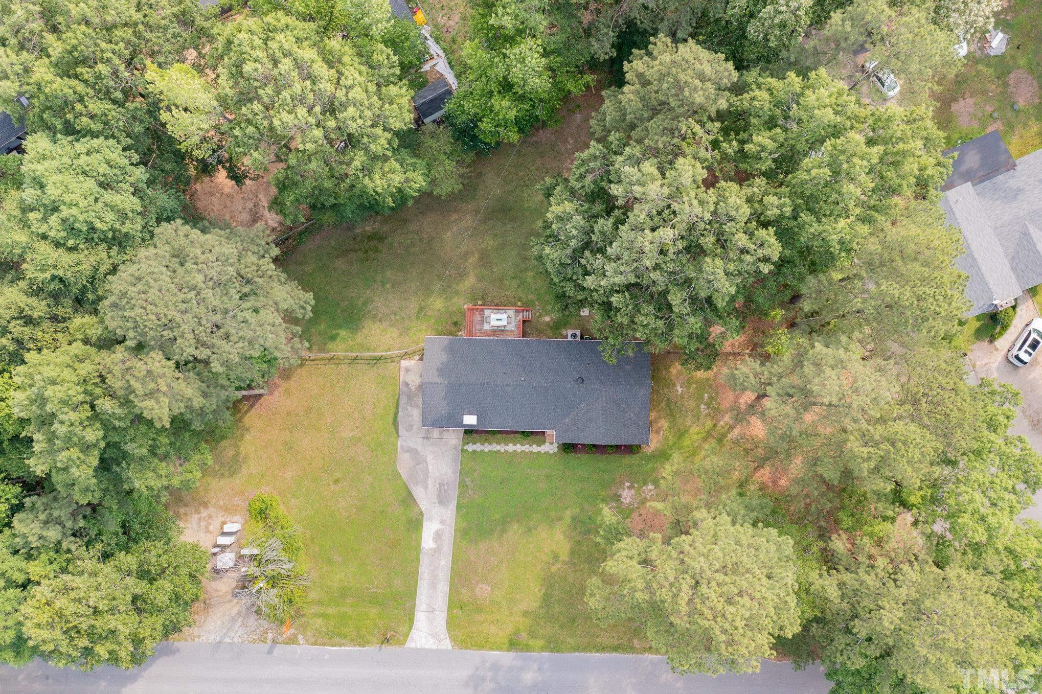 1712 Riverview Road Raleigh, NC 27610 - Photo 4 of 27 an aerial view of a house with a yard basket ball court and outdoor seating