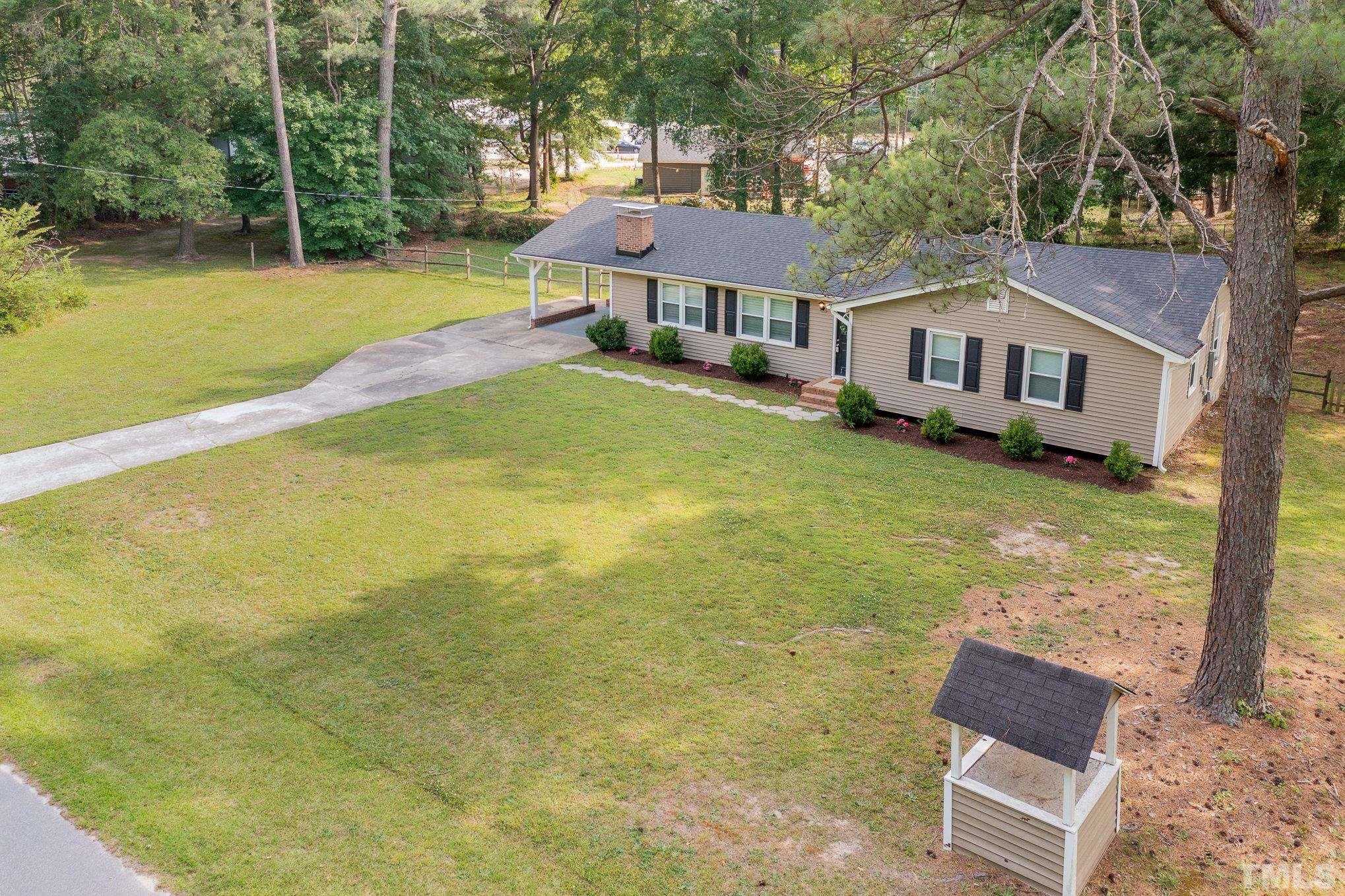 1712 Riverview Road Raleigh, NC 27610 - Photo 6 of 27 a front view of a house with swimming pool