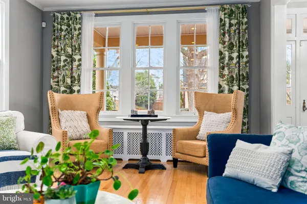 a kitchen with a stove and a wooden floor