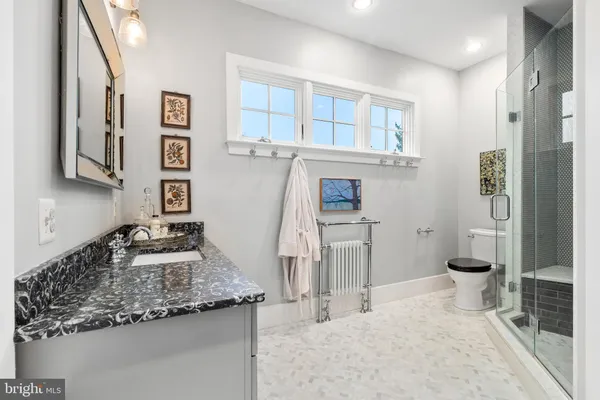 an aerial view of a house with a garden and a yard