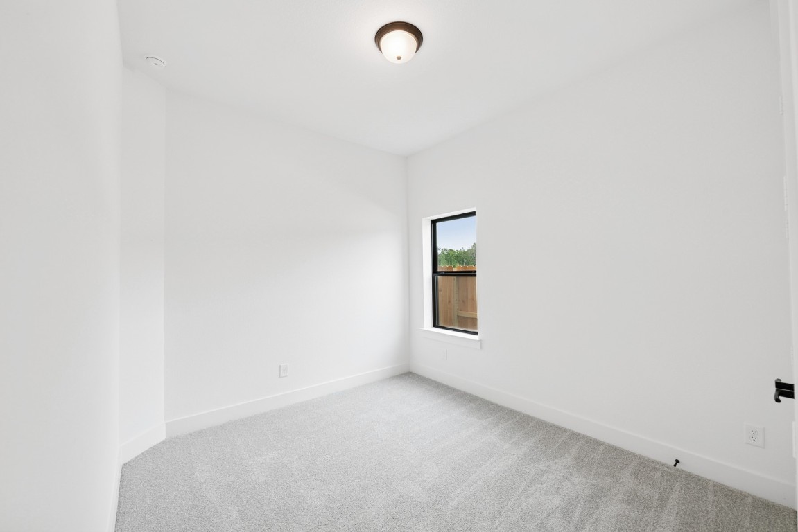 8731 Mancos Valley Porter, TX 77365 - Photo 16 of 46 a view of an empty room with a window