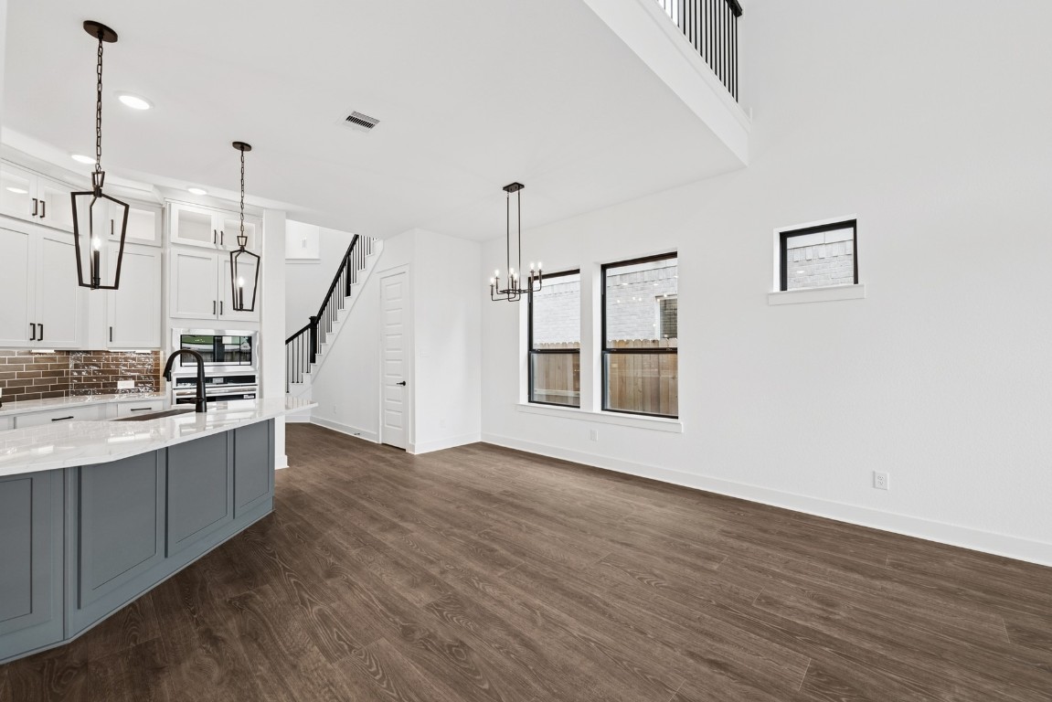8731 Mancos Valley Porter, TX 77365 - Photo 22 of 46 a view of a kitchen with wooden floor and a sink