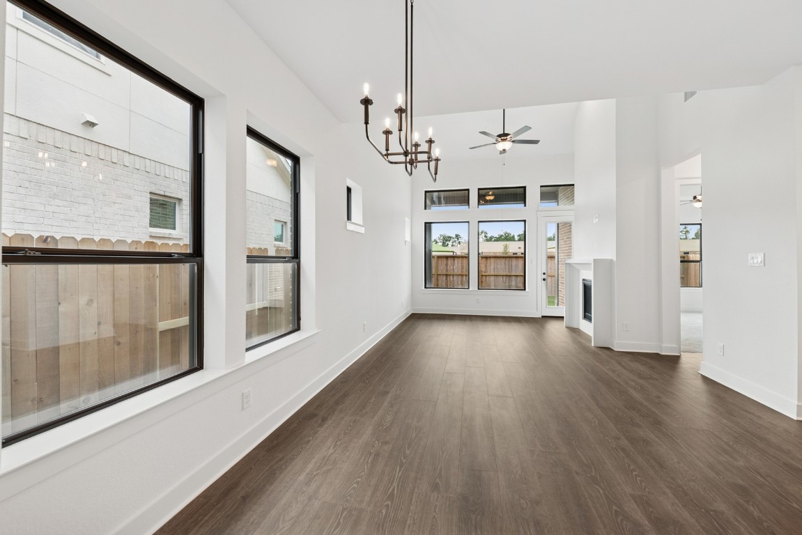8731 Mancos Valley Porter, TX 77365 - Photo 23 of 46 wooden floor in an empty room with a window