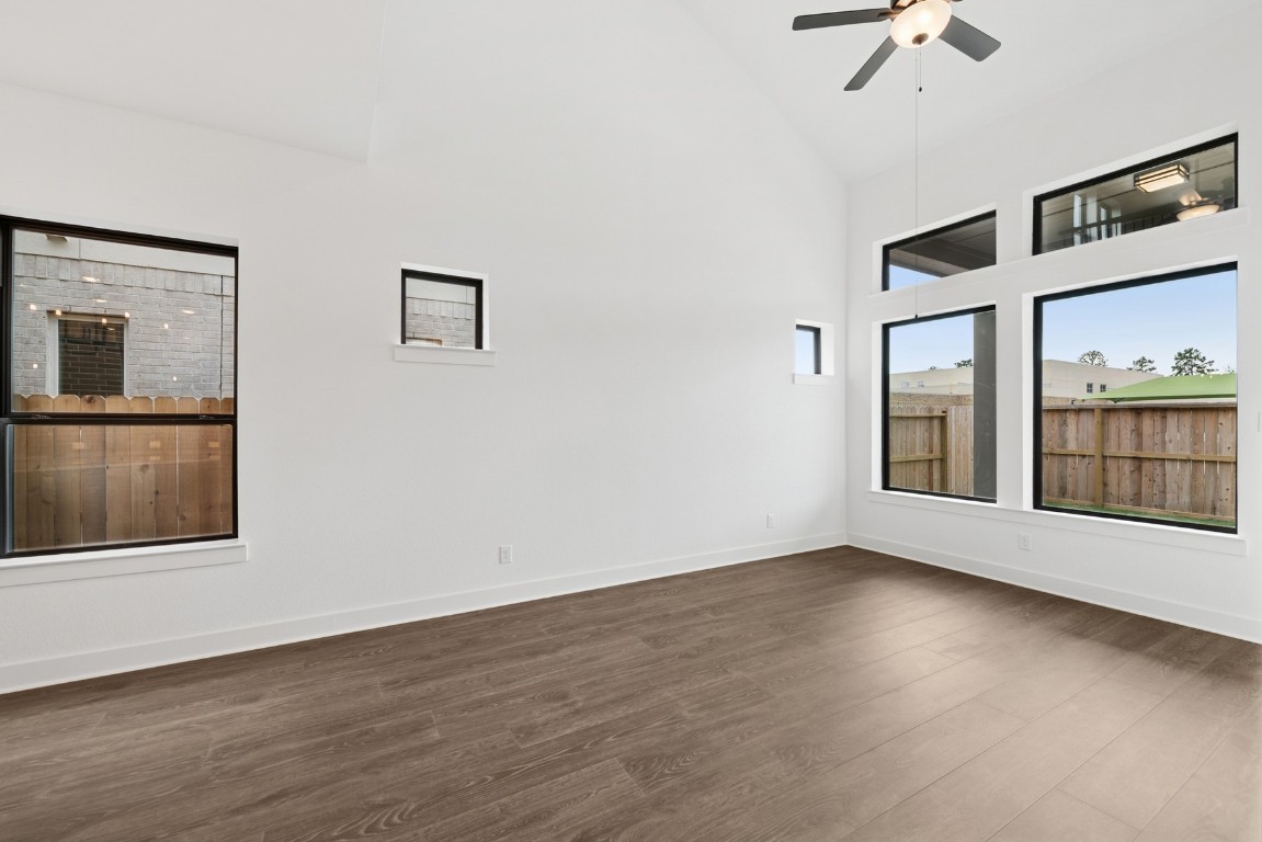 8731 Mancos Valley Porter, TX 77365 - Photo 28 of 46 a view of an empty room with a window and wooden floor
