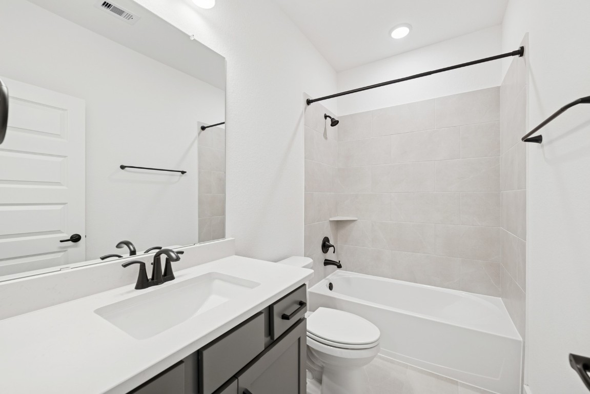 8731 Mancos Valley Porter, TX 77365 - Photo 40 of 46 a bathroom with a sink a toilet and a bathtub