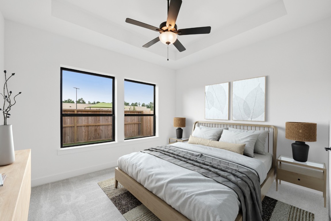 8731 Mancos Valley Porter, TX 77365 - Photo 6 of 46 a bedroom with a large bed and a large window