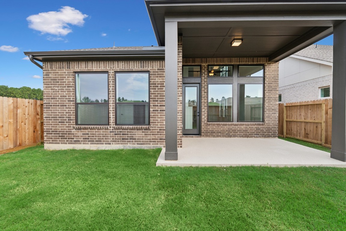 8731 Mancos Valley Porter, TX 77365 - Photo 8 of 46 a front view of a house with a garden
