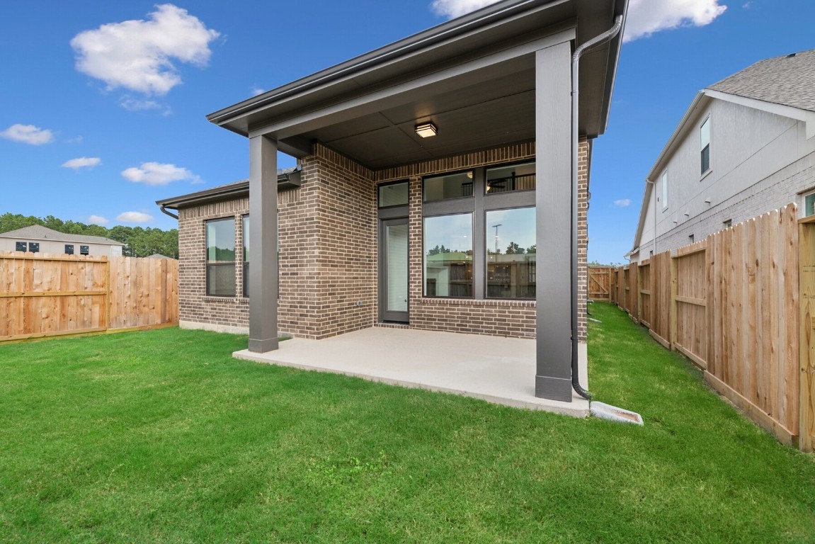 8731 Mancos Valley Porter, TX 77365 - Photo 10 of 46 a view of a porch with a yard