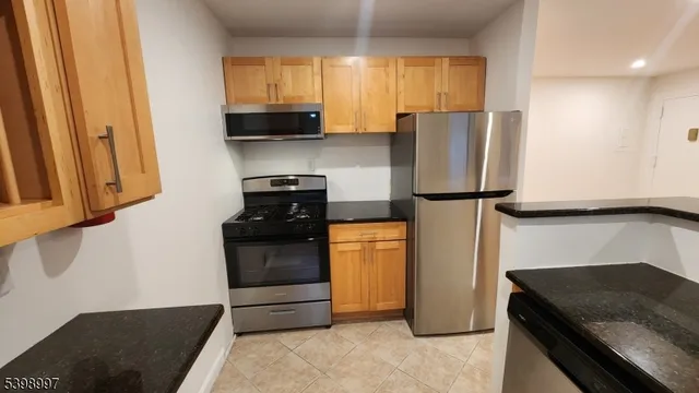 a bathroom with a sink toilet double vanity and tub