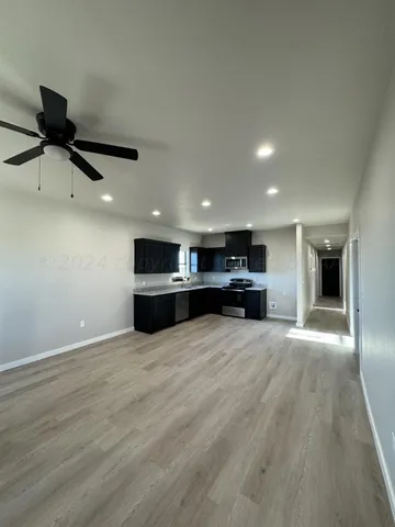a bathroom with a double vanity sink toilet and shower