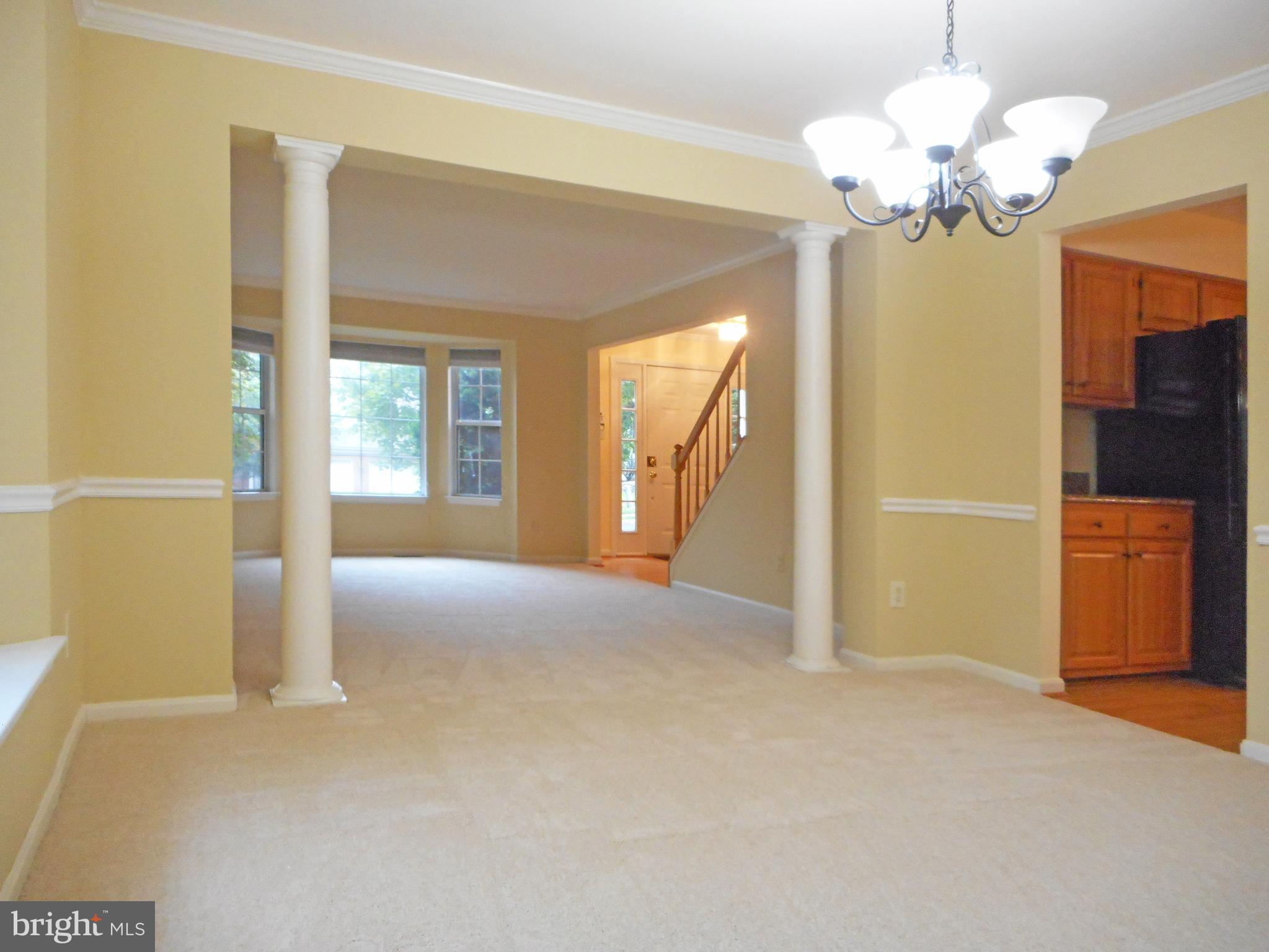 21289 Mirror Ridge Place Sterling, VA 20164 - Photo 9 of 30 Dining Room view into Formal Living Room