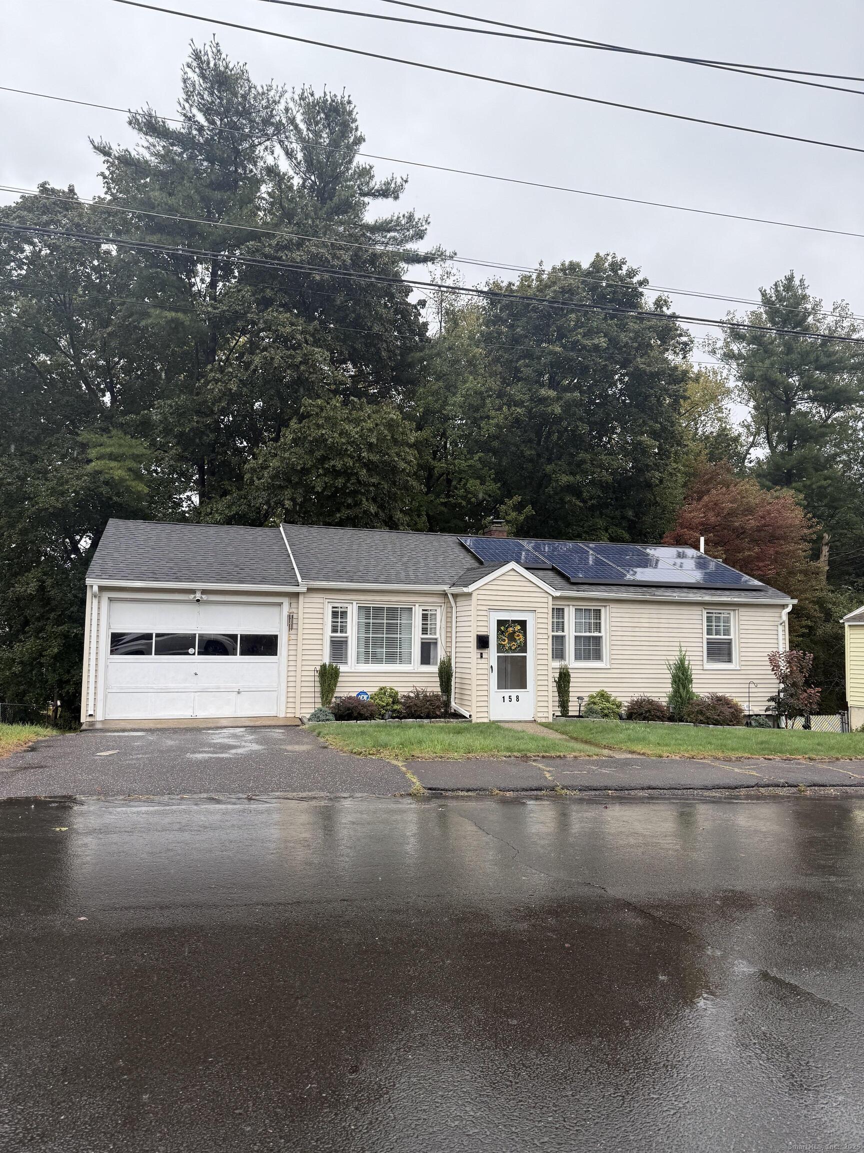 158 Monroe Avenue Waterbury, CT 06705 - Photo 12 of 12 front view of house with a street