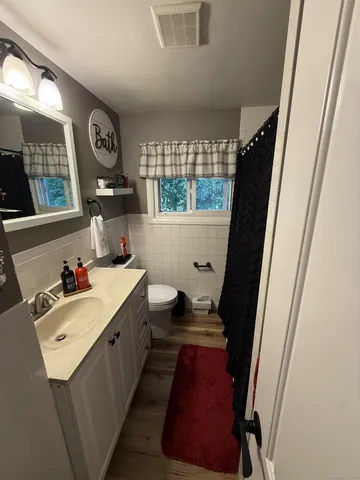 a bathroom with sink and mirror