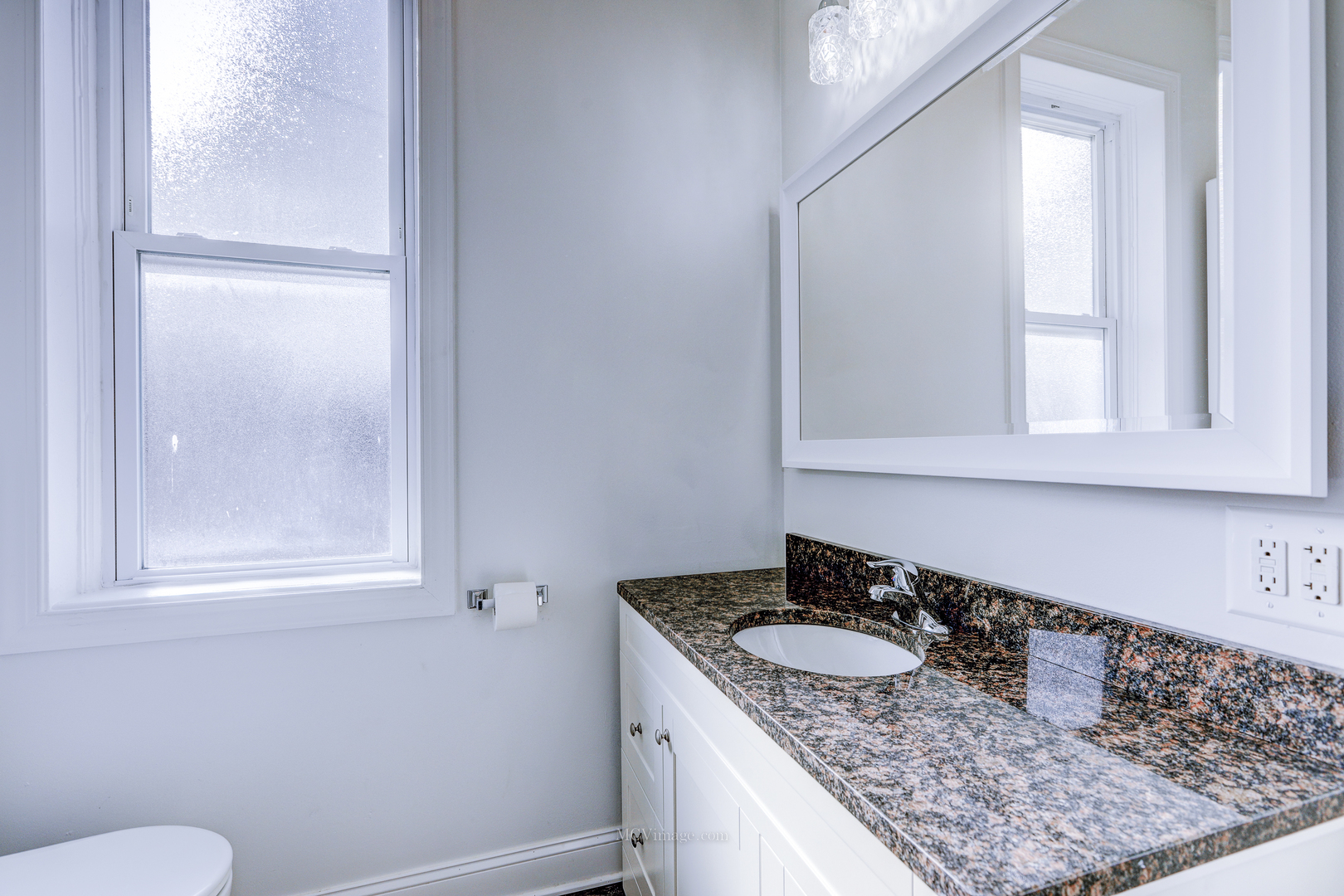 224 Lemont Street, Unit 5 Lemont, IL 60439 - Photo 15 of 21 a bathroom with a granite countertop sink and a mirror