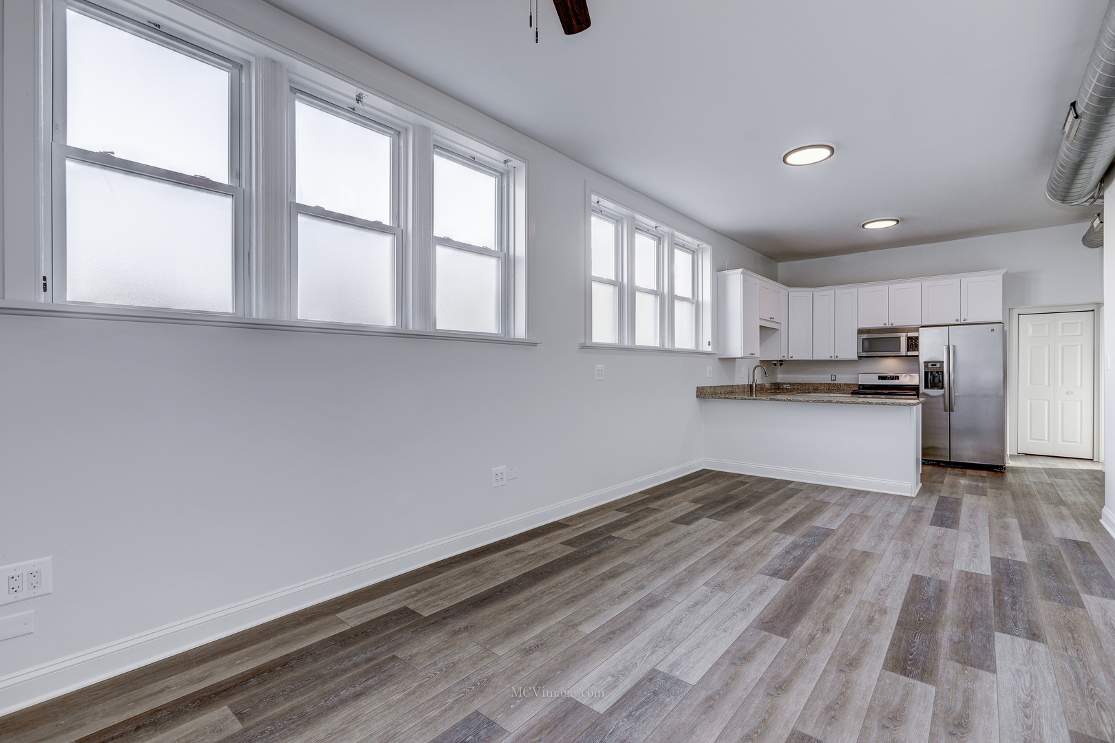 224 Lemont Street, Unit 5 Lemont, IL 60439 - Photo 6 of 21 a view of kitchen with wooden floor