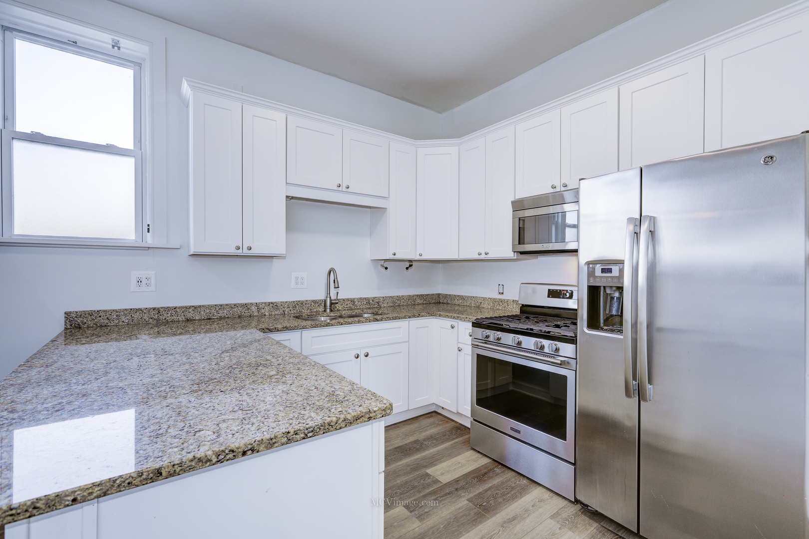 224 Lemont Street, Unit 5 Lemont, IL 60439 - Photo 7 of 21 a kitchen with stainless steel appliances granite countertop a stove a refrigerator and a sink