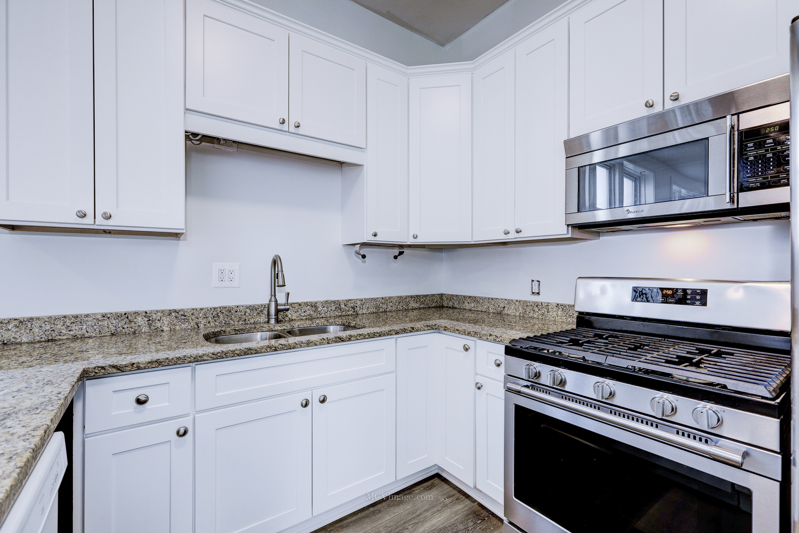 224 Lemont Street, Unit 5 Lemont, IL 60439 - Photo 8 of 21 a kitchen with granite countertop cabinets stainless steel appliances and a sink