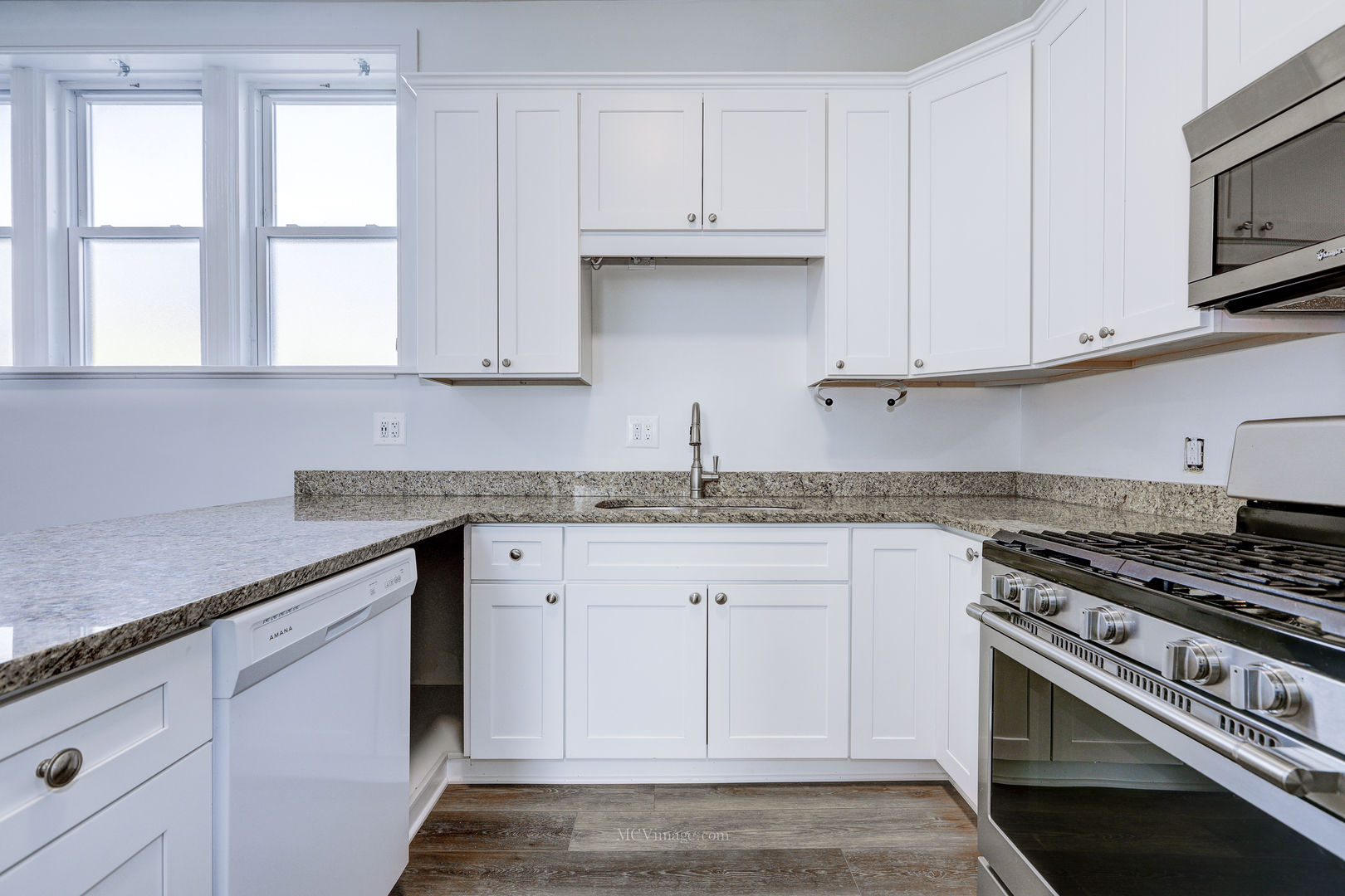 224 Lemont Street, Unit 5 Lemont, IL 60439 - Photo 9 of 21 a kitchen with granite countertop white cabinets and a stove