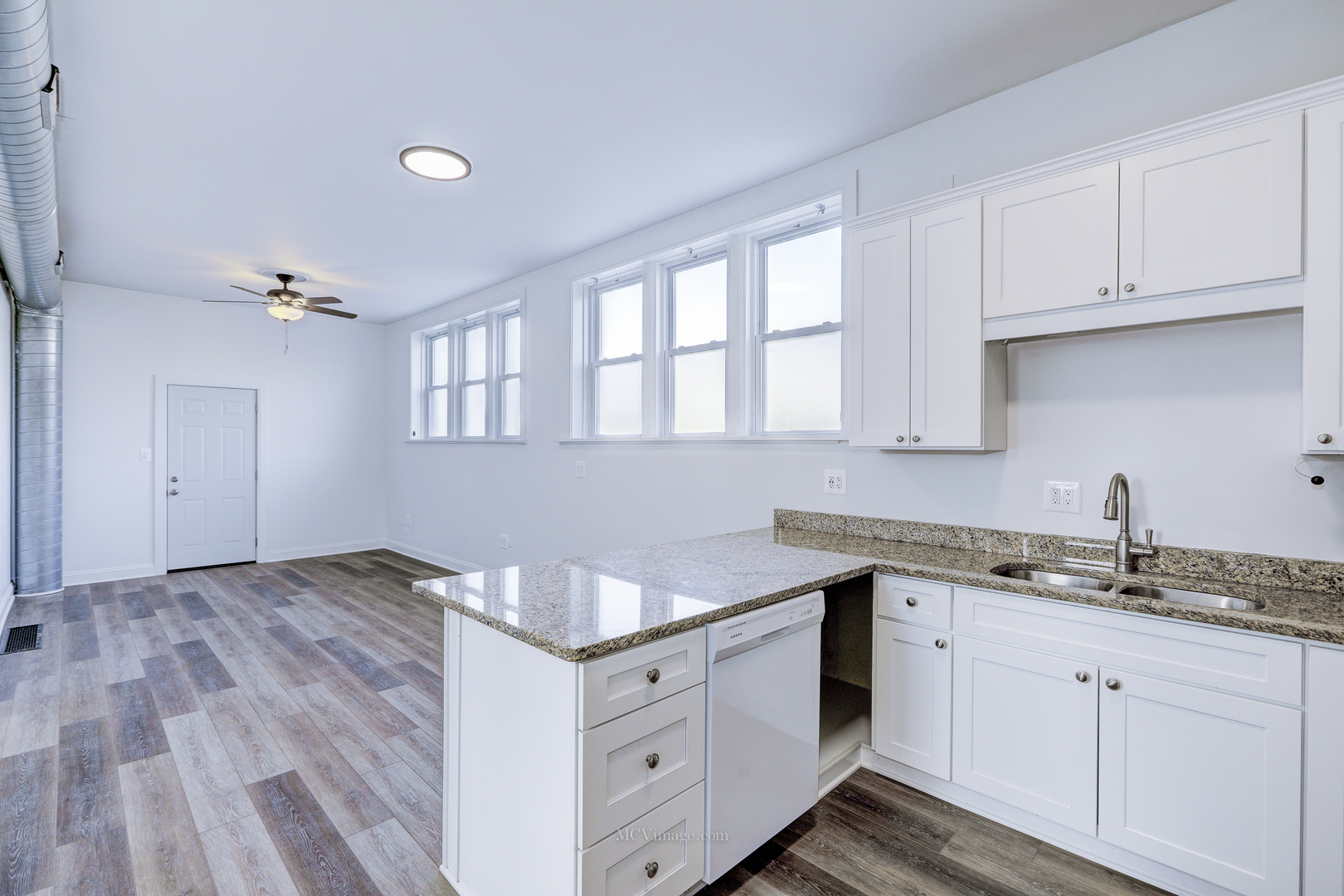 224 Lemont Street, Unit 5 Lemont, IL 60439 - Photo 10 of 21 a kitchen with granite countertop white cabinets and white appliances