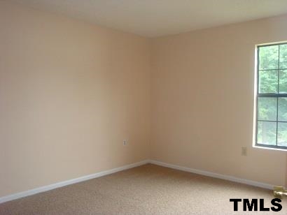 7765 Falcon Rest Circle, Unit 1 Raleigh, NC 27615 - Photo 8 of 12 an empty room with a window