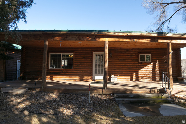 348 North Jakes Pl Road Loa, UT 84747 - Photo 26 of 26 Back of house with covered porch