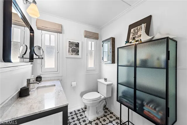 a bathroom with a toilet sink and shower