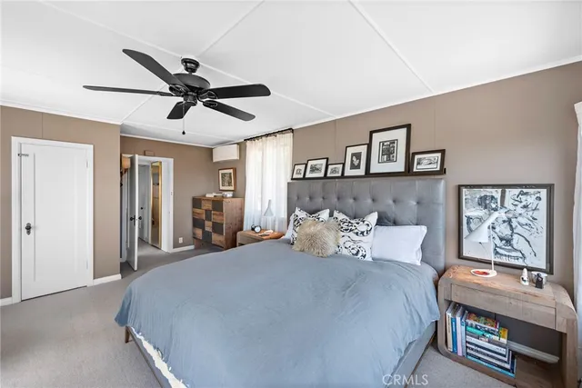 a bedroom with bed and window