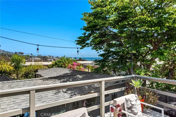 a view of a balcony with an outdoor seating