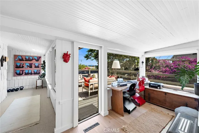 a room with furniture and a flat screen tv