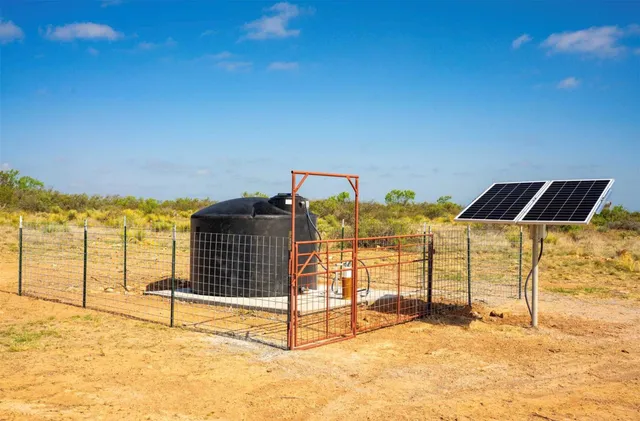 a view of a lake with a yard