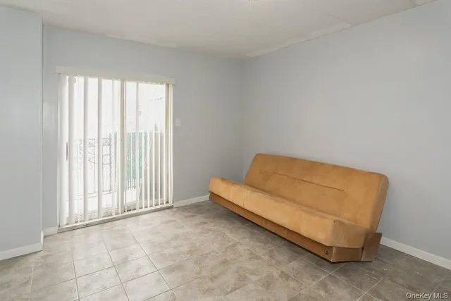 a room with a bed and a window